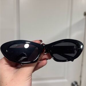 Miu Miu Glossy Black Oval Sunglasses